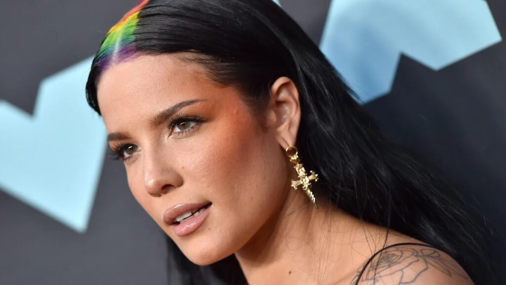 Halsey, singer posing for a red carpet photo. Close up on her face